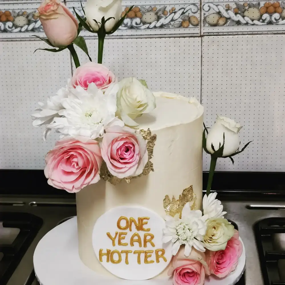 Ivory Floral Anniversary cake by Bilkis Cakes and Bakes